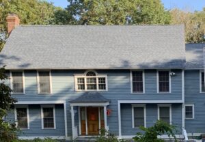 cornflower blue siding with grey asphalt roof